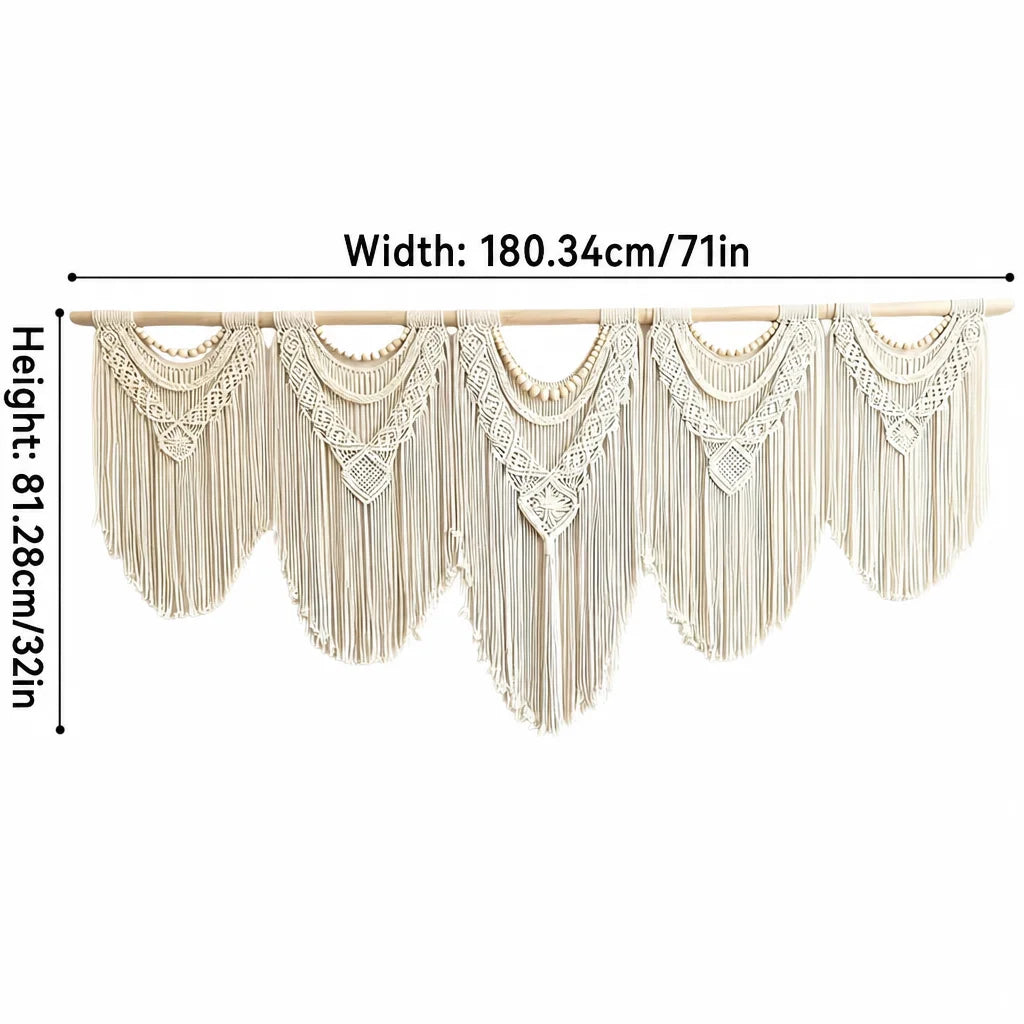 Cream macrame wall hanging with wooden rod, layered scalloped bands and dangling fringe tassels