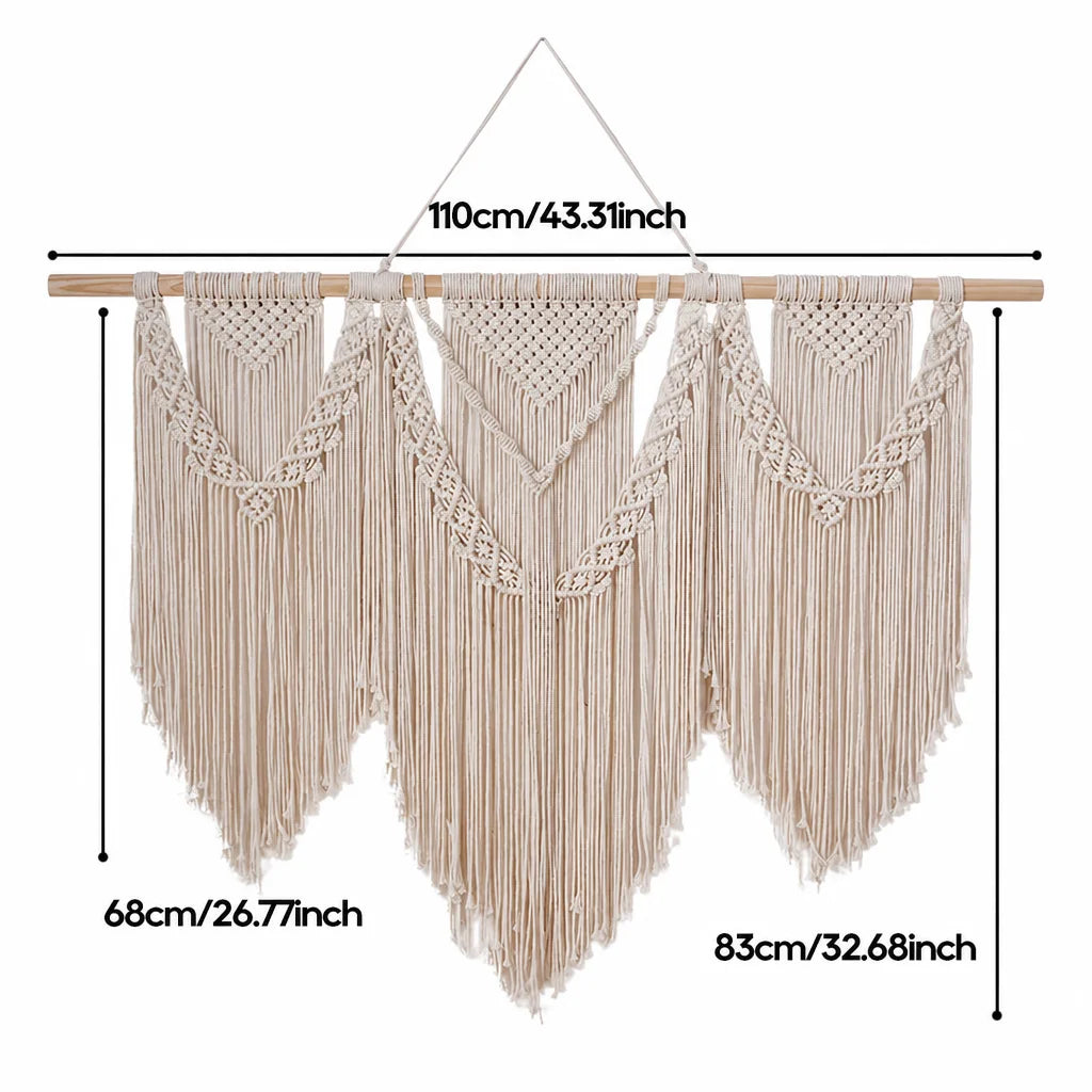 Cream cotton macrame wall hanging with wooden dowel and repeating triangle motifs with long fringe