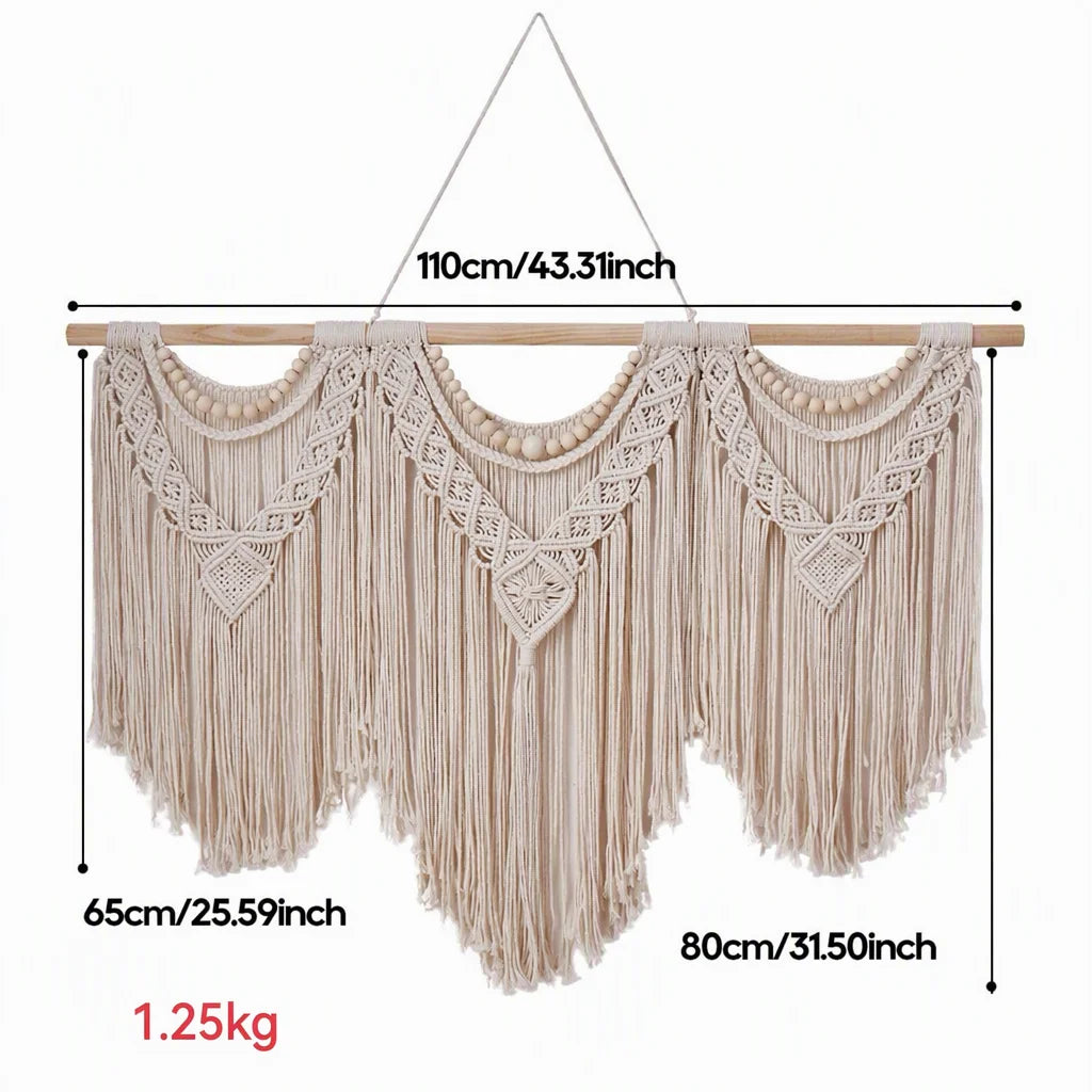 Cream cotton macrame wall hanging with wooden dowel and layered V-shaped pattern with long fringe
